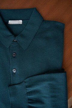 Shirt neatly folded on a wooden surface