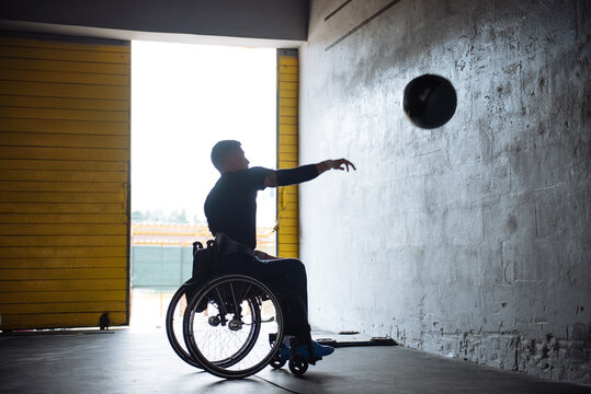 Wheelchair Athlete Training With Medicine Ball