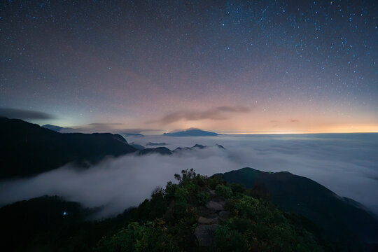 Night Above the Clouds on a High Mountain Ridge