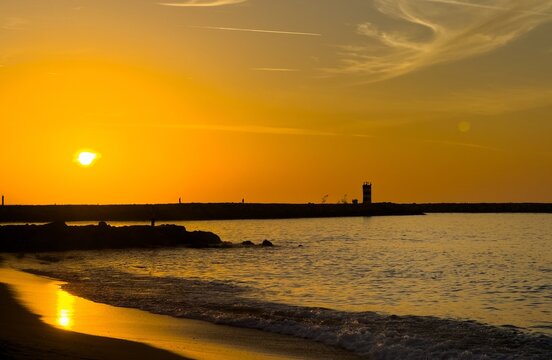  colorful dramatic sunset with cloudy sky . Evening calm Algarve, Portugal