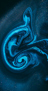 Ink spill. Sparkling fluid. Defocused blue color glitter mix acrylic bright texture floating on abstract marble art background.