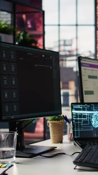 Woman in tech office typing at computer working with ai