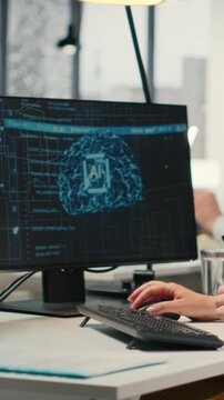 Woman typing at computer in modern office