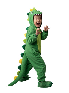 Asian boy wearing a green dinosaur costume roaring playfully