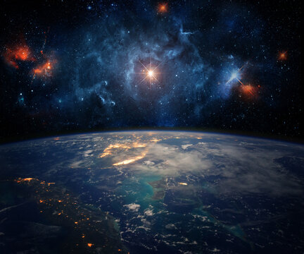 Earth from space with bright stars, colorful nebula and deep cosmic sky above the planet horizon. Futuristic astronomy background with galaxy, universe. Elements of this image furnished by NASA.