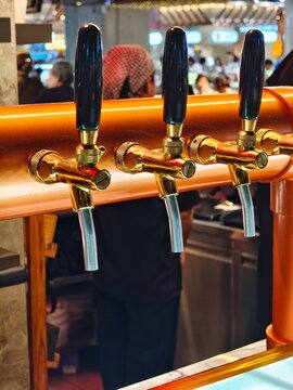 Beer tap dispenser for draft beer, Pub Bar Brewery Equipment, Alcoholic Drink Service, Faucet Handle, Oktoberfest Celebration, Closeup Shot
