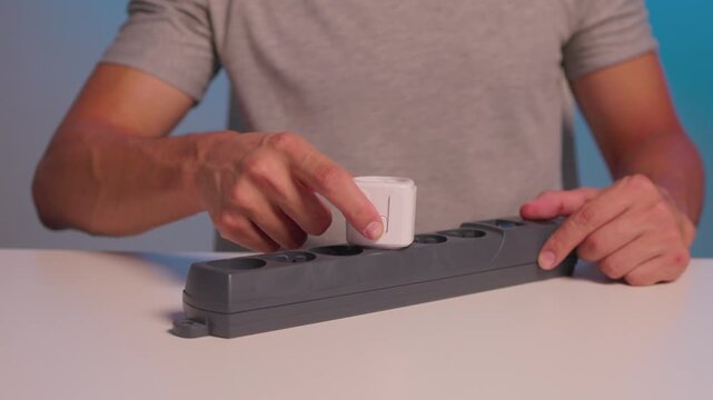 Smart plug handson setup. User demonstrates quick smart socket operation. Individual showcases effortless installation and immediate control of smart electrical devices