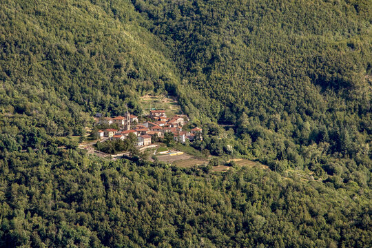 village of Massa Sassorosso, a small mountain settlement nestled in the dense forests of the Apuan Alps region within the Garfagnana valley of northern Tuscany