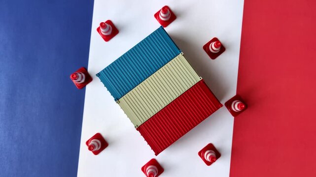 The cargo container ban on the French flag as a conceptual backdrop. Cargo container embargo
