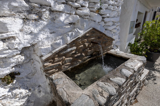A fresh water fountain on a street in Trevelez in the Alpujarras of Granada, Andalusia, Spain
