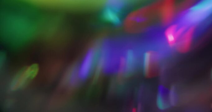 Blur abstract flare. Glare art. Defocused blue yellow pink multicolor radiant spectrum optical neon glint texture on visual dark black background.