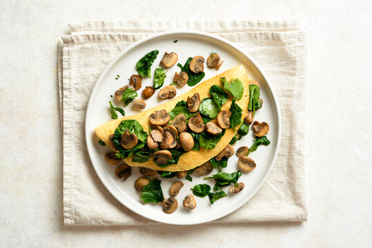 Delicious omelette with mushrooms and spinach