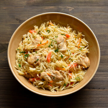 Pilaf with chicken meat, onion, carrots and basmati rice