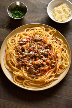 Spaghetti pasta dish with meaty tomato sauce, made with beef and pork, onions, tomato, and herbs