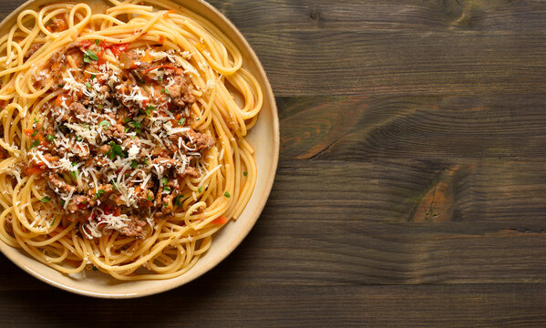 Spaghetti pasta dish with meaty tomato sauce, made with beef and pork, onions, tomato, and herbs