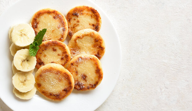 Delicious cottage cheese pancakes with banana slices