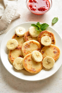 Delicious curd cheese pancakes with banana slices