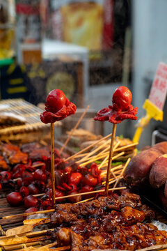 Tako tamago octopus skewers at a Japanese street food stall, Osaka