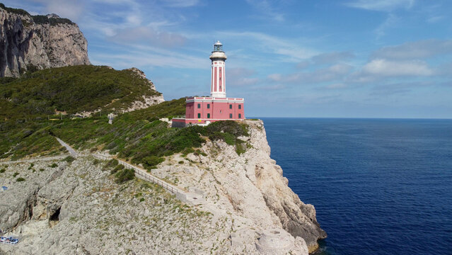 Aerial view of Capri lighthouse with coastline and Mediterranean sea landscape