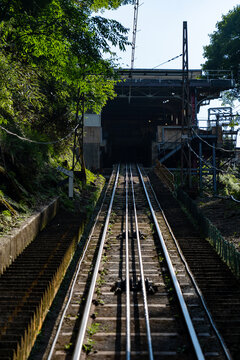 Funicular railway tracks climbing towards a mountain station, Japan