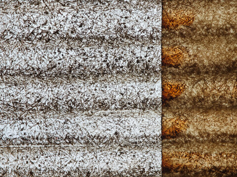 Close view of thatch fibres catching light across a woven roof surface
