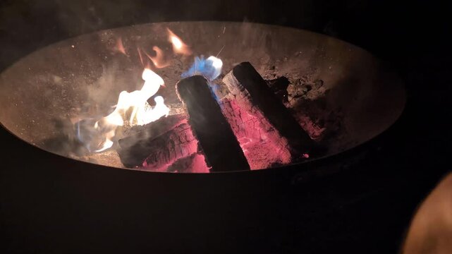 small camp fire in a fire pit