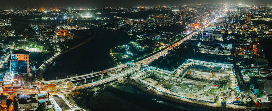 Illuminated Chennai cityscape at night with glowing lights aerial nightscape