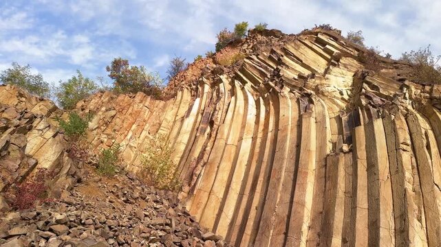 Ground view of basalt prisms near Sylce in Ukraine&rsquo;s Carpathians, hexagonal volcanic formations created by lava cooling millions of years ago, illuminated by autumn sunset light