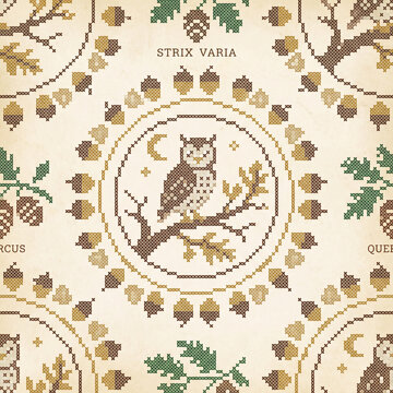 Seamless pattern featuring a decorative cross stitch owl perched on an oak branch with acorns and leaves in a vintage folk art style on a textured beige paper background design