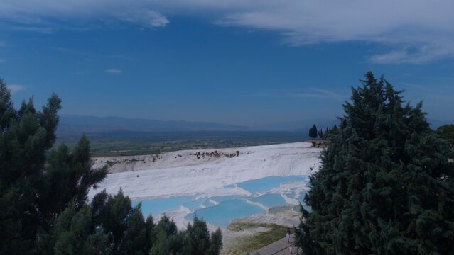 Aerial panoramic view of travertine thermal pool terraces at Pamukkale, T&uuml;rkiye