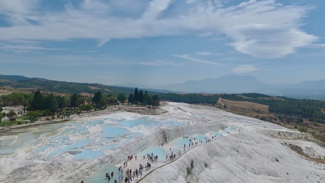 Aerial panoramic view of travertine thermal pool terraces at Pamukkale, T&uuml;rkiye