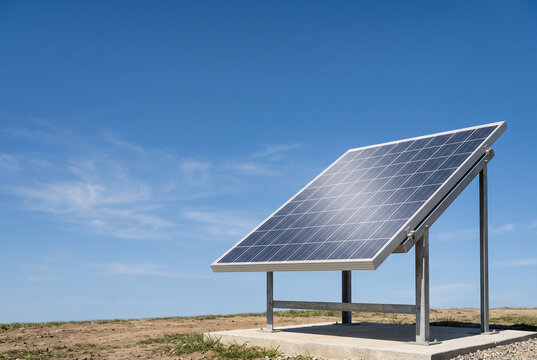 Solar panel beneath clear blue sky with copy space