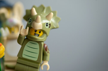 Obraz premium Close up of the Lego minifigures Animals triceratops on a gray background.