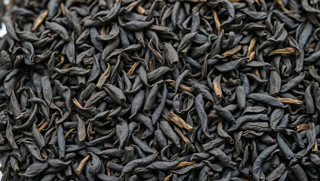 Macro texture background of premium dry black tea leaves