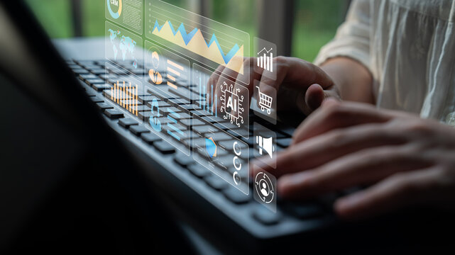 A close-up view of a person typing on a laptop with visual overlays of data charts and graphs, emphasizing the intersection of technology and business analysis for modern workflows. Ledger