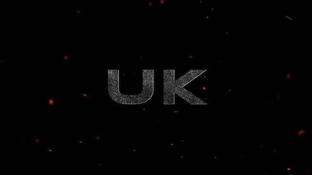 UK text logo with metallic distressed texture surrounded by glowing embers