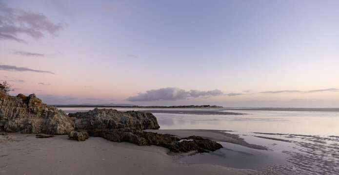 beautiful sunset and dusk light falling upon Grotto lagoon and rock formations, Hermanus, South Africa