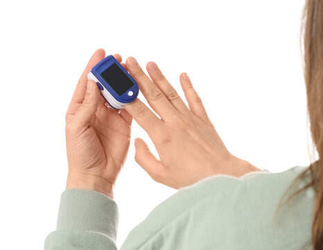 Pulse oximetry and health monitoring, person using a finger pulse oximeter to check blood oxygen saturation and heart rate at home for wellness
