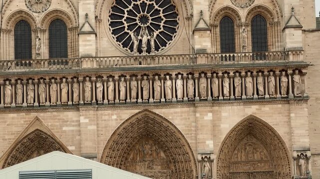 On a cloudy day in Paris, Notre-Dame Cathedral currently undergoing restoration following the fire is once again the site of ongoing architectural restoration work.