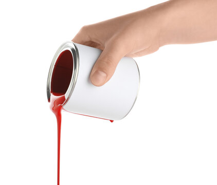Home improvement and renovation, hand pouring red paint from a metal can for interior design and DIY projects isolated on a white background