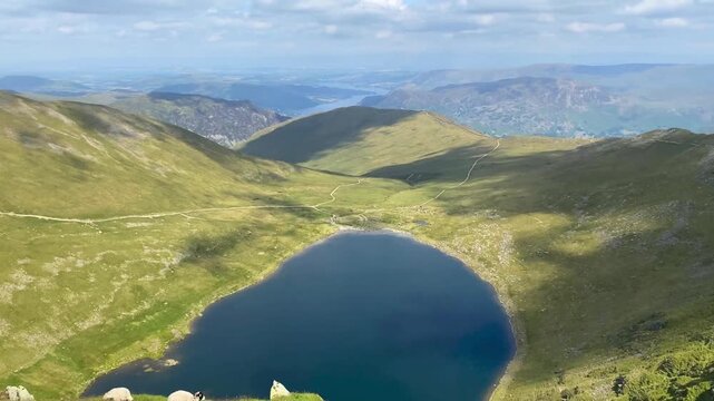 High Angle Pan of Striding Edge and Red Tarn Below Helvellyn Summit