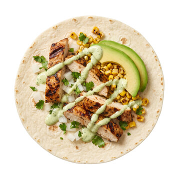 Grilled chicken taco with avocado corn salsa and cilantro sauce on a flour tortilla