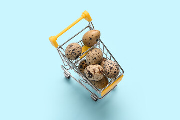 Food inflation and grocery costs, quail eggs in a miniature shopping cart rising prices and consumer spending on fresh organic food © Pixel-Shot