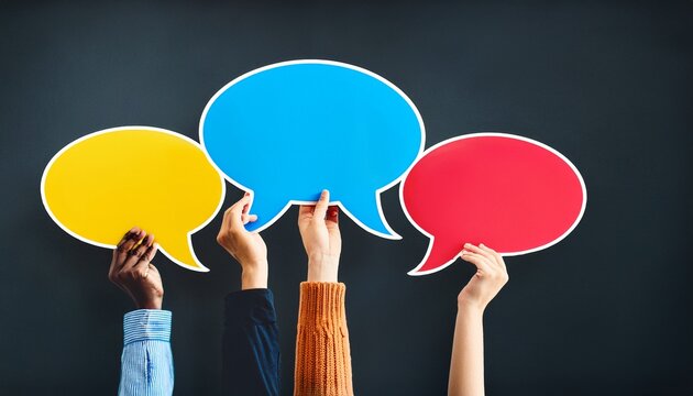 diverse hands holding colorful speech bubbles on a dark background concept of communication dialogue and multiculturalism