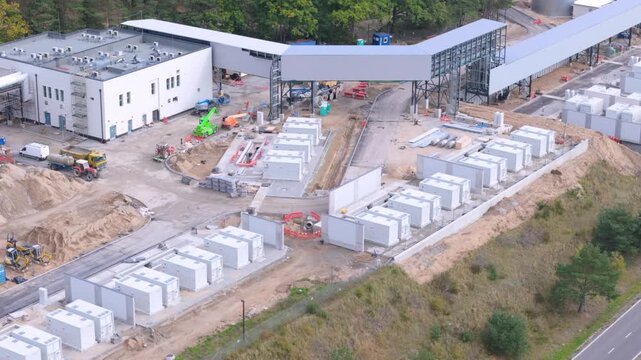 Aerial view of a large-scale battery energy storage system construction site representing clean energy infrastructure and power grid transition.