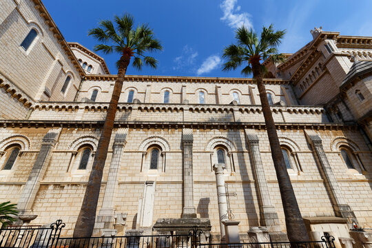 Side facade of Monaco Cathedral in Romano-Byzantine white stone with arched windows, Monaco-Ville, French Riviera