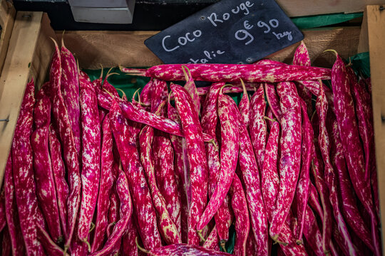 Fresh red Coco Rouge beans at a farmers market vegetable stand, Antibes, France