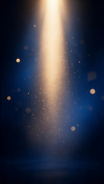 Abstract blue and gold light beam background with glowing particles