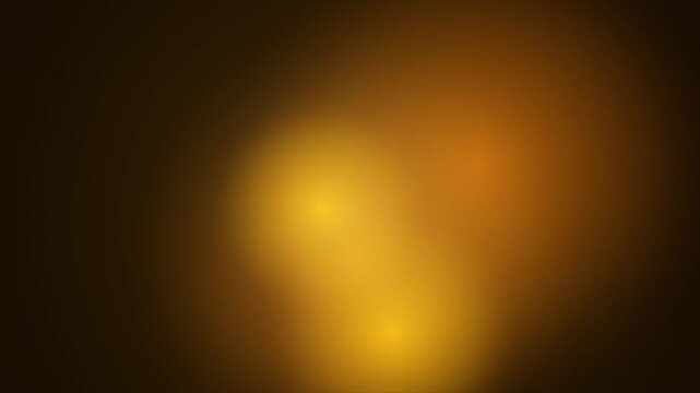 Abstract gold background with soft lighting effect and vignette warm golden glow or glowing light spot for design, template, and presentation