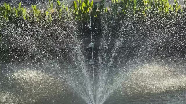 Water fountain spraying in pond in Chiang Mai